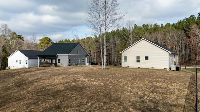 rear view of property featuring covered porch and a lawn