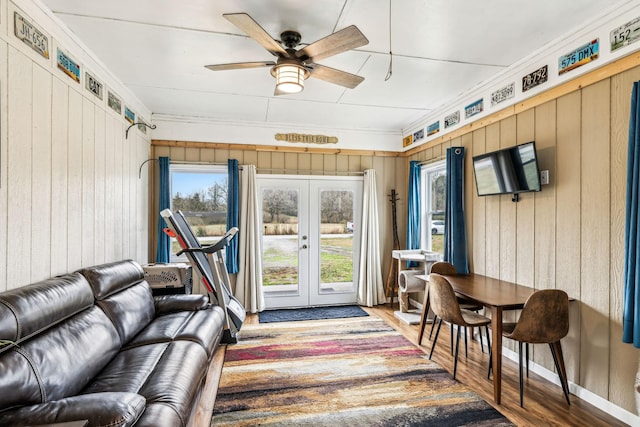 sunroom with french doors and ceiling fan