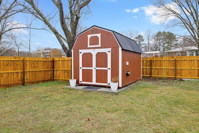 view of outbuilding featuring a lawn