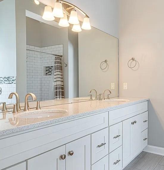 bathroom with vanity and walk in shower