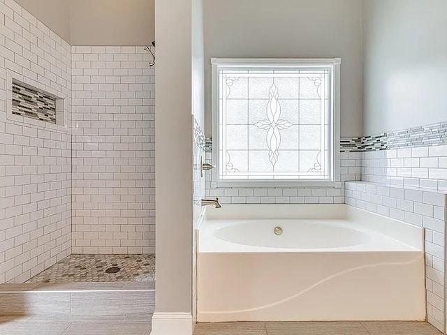 bathroom featuring independent shower and bath and tile patterned floors