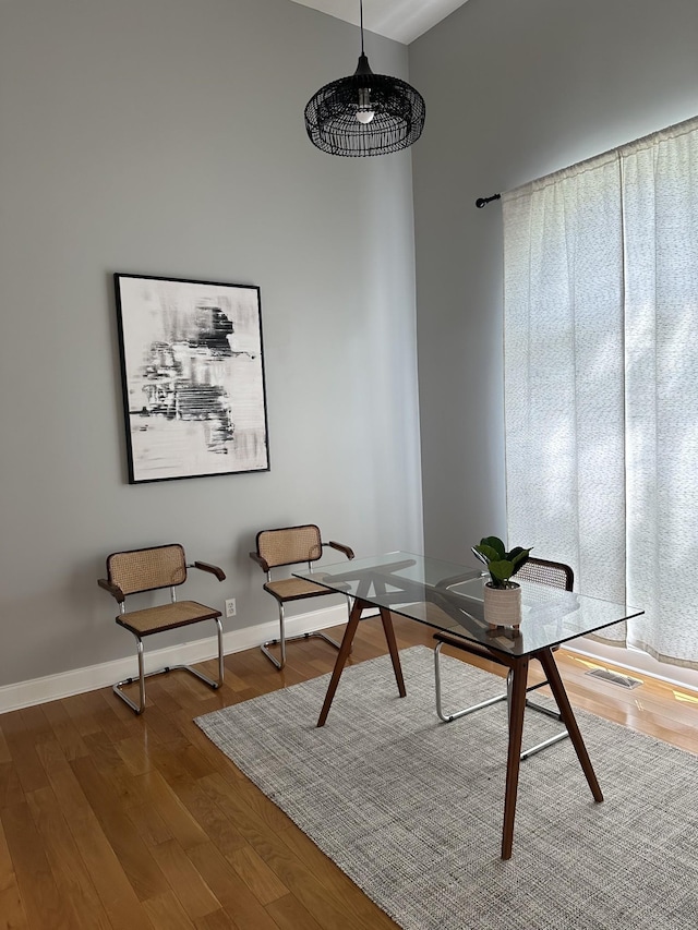 office space with wood-type flooring