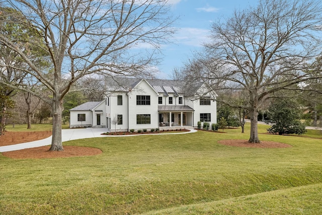 view of front facade with a front yard and a porch