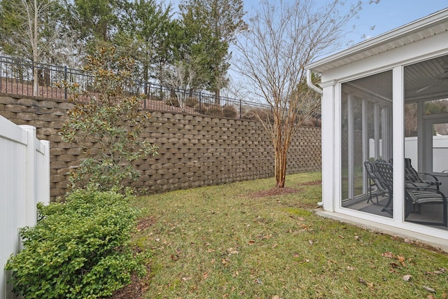 view of yard featuring a sunroom