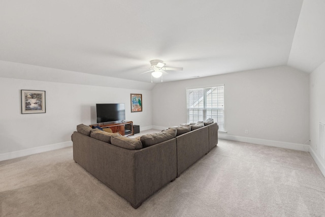 living room with lofted ceiling, light colored carpet, and ceiling fan