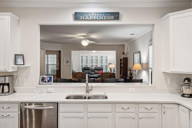 kitchen featuring sink, stainless steel dishwasher, and white cabinets