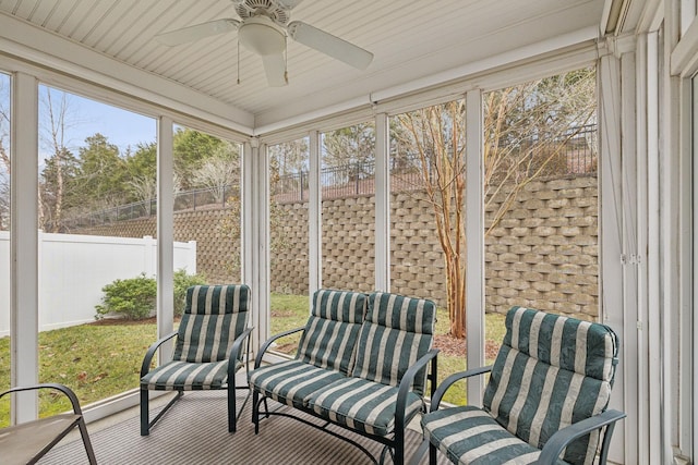 sunroom / solarium with ceiling fan