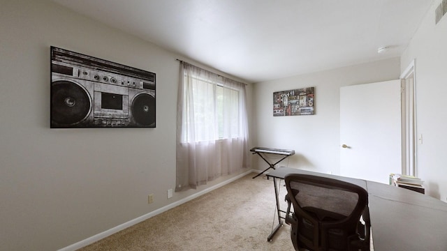 office featuring carpet, visible vents, and baseboards