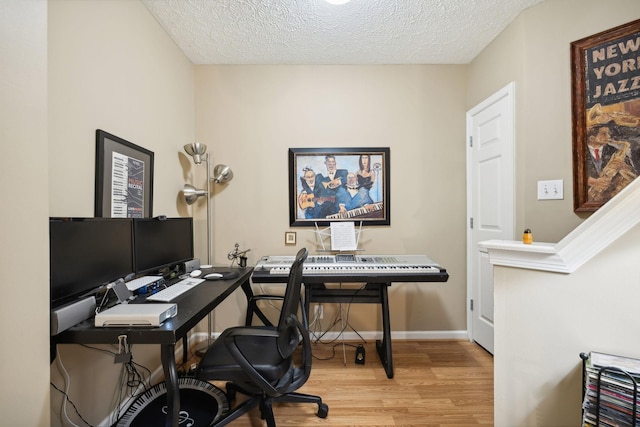 office featuring hardwood / wood-style flooring and a textured ceiling