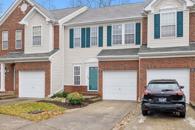 multi unit property featuring a garage