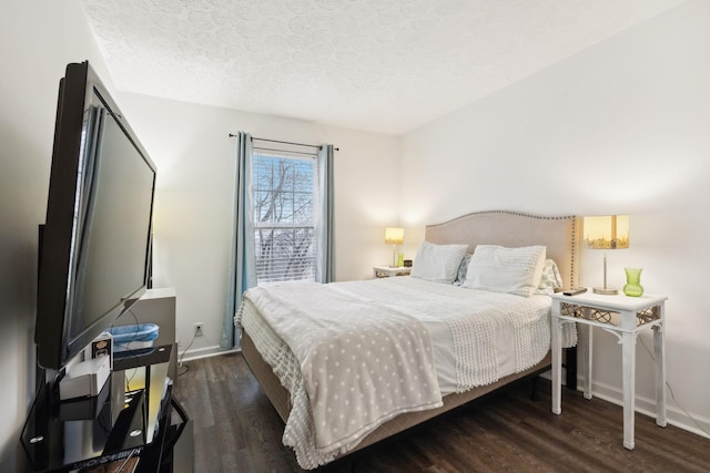 bedroom featuring dark hardwood / wood-style floors and a textured ceiling