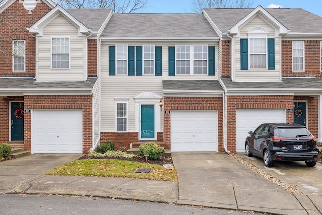 multi unit property featuring a garage