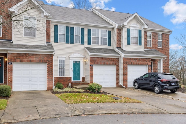 townhome / multi-family property featuring a garage