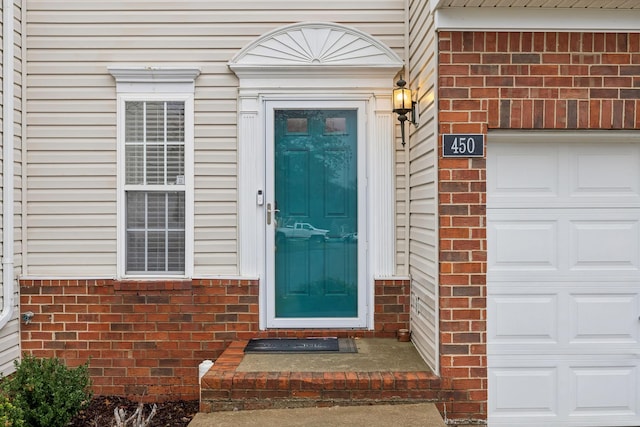 property entrance with a garage