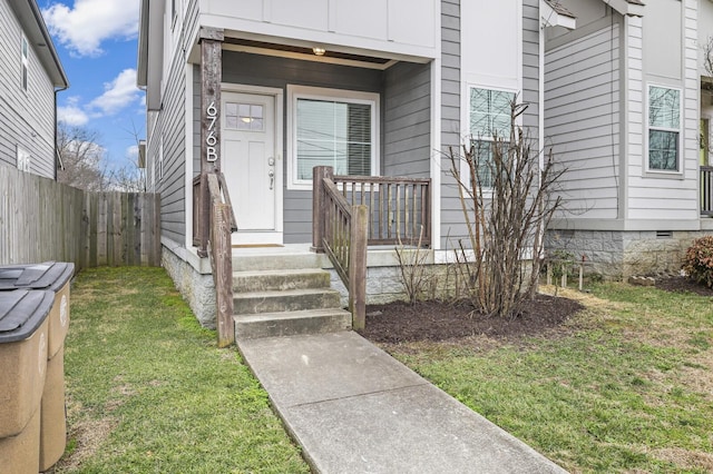 property entrance featuring a yard