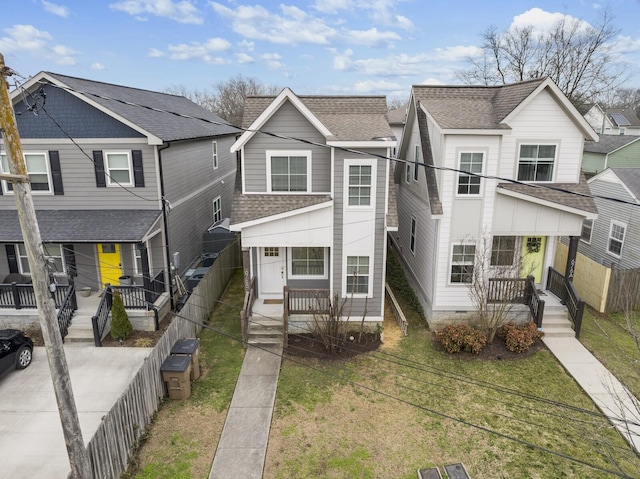 view of front of home featuring covered porch and a front yard