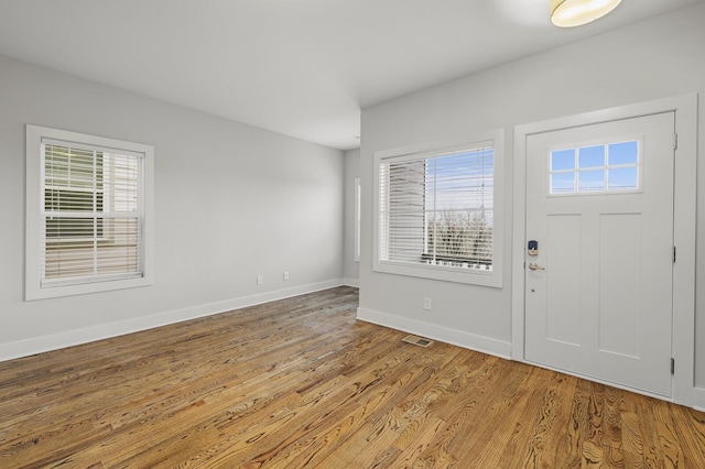 foyer with light wood-type flooring