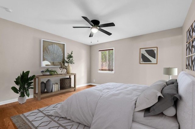 bedroom featuring hardwood / wood-style flooring and ceiling fan