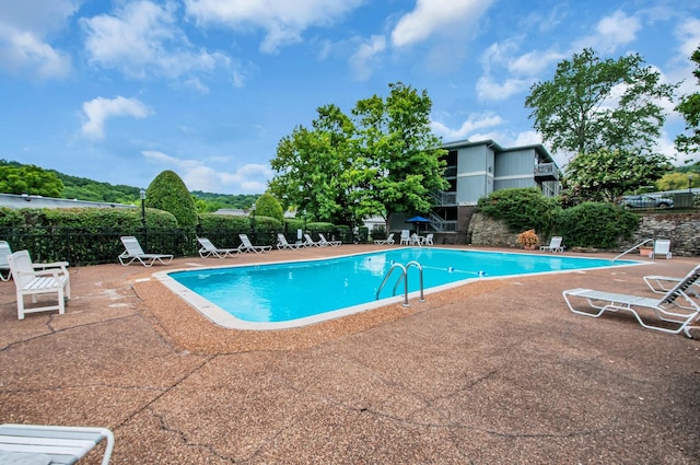 view of pool featuring a patio area