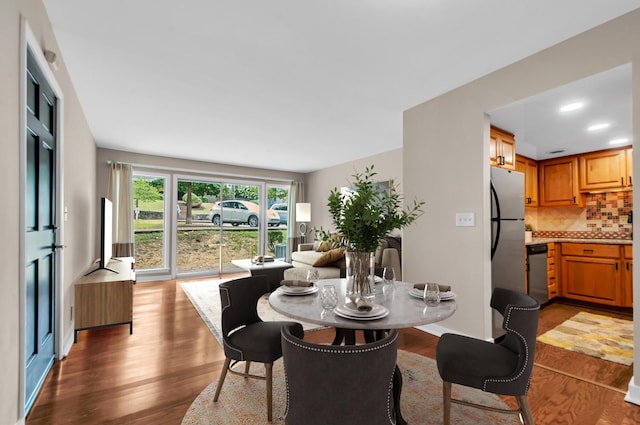 dining room with wood-type flooring