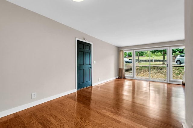 unfurnished room featuring light hardwood / wood-style floors