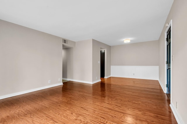 unfurnished room featuring wood-type flooring