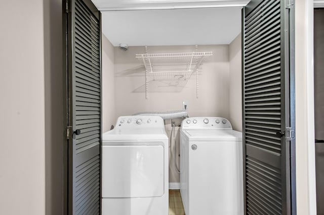 laundry area with washing machine and clothes dryer