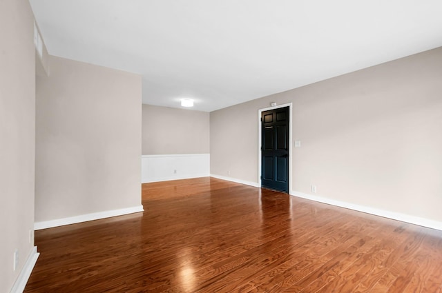 empty room featuring hardwood / wood-style flooring