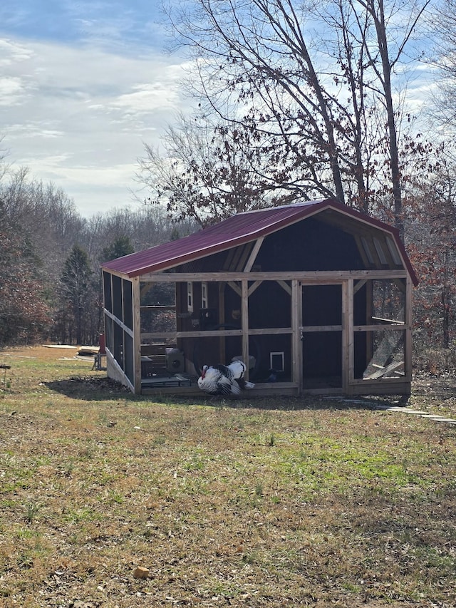 view of outdoor structure with a yard