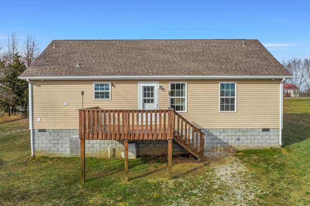 back of property with a shingled roof, crawl space, a lawn, and a wooden deck