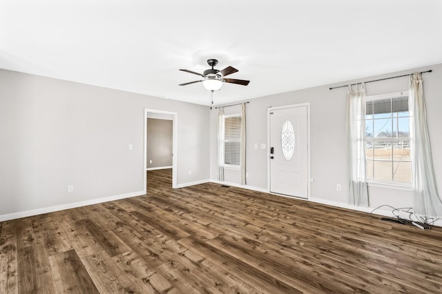 entryway featuring dark wood-style floors, baseboards, and a ceiling fan