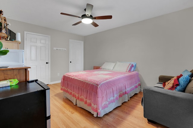 bedroom featuring ceiling fan and light wood-type flooring