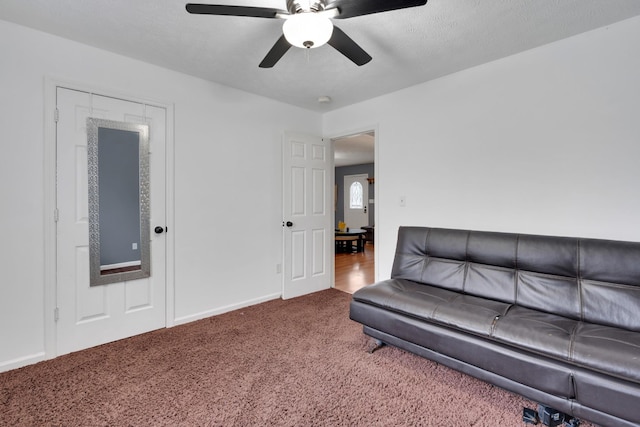 unfurnished living room with carpet floors and ceiling fan