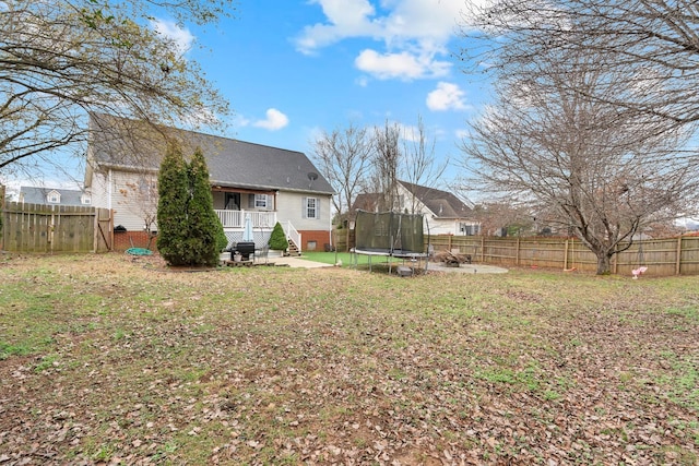 view of yard with a trampoline