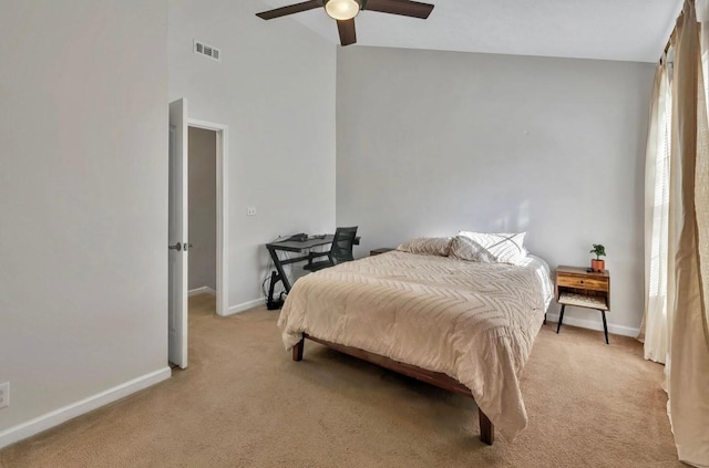 carpeted bedroom with lofted ceiling and ceiling fan