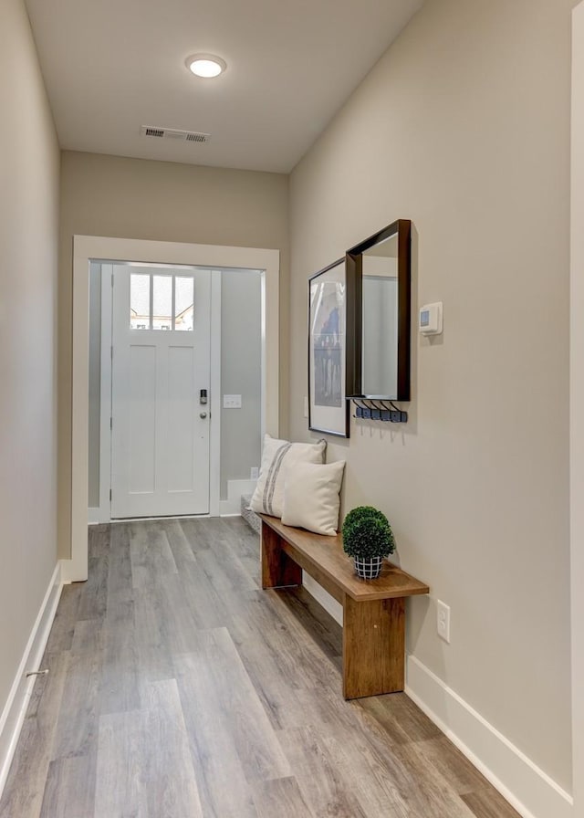 doorway to outside with light hardwood / wood-style floors