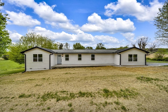 back of house featuring a yard