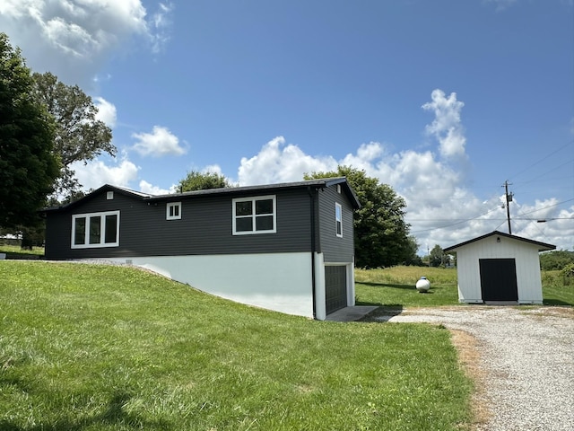 1705 Haire Rd, Dandridge, TN 37725 - view of property exterior with a garage, driveway, and a yard