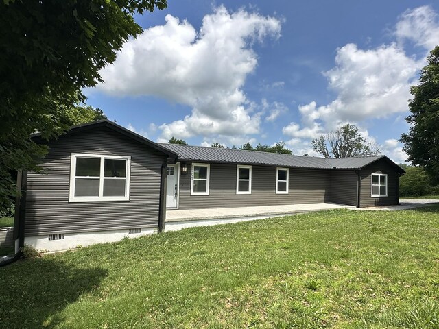 1705 Haire Rd, Dandridge, TN 37725 - view of front of house with a front lawn, a metal roof, and crawl space