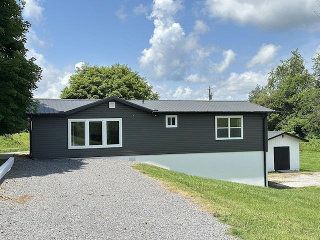 1705 Haire Rd, Dandridge, TN 37725 - back of house with a metal roof and an outdoor structure