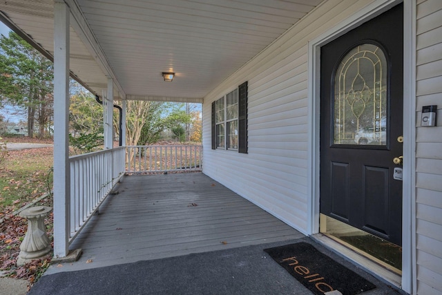 property entrance featuring covered porch