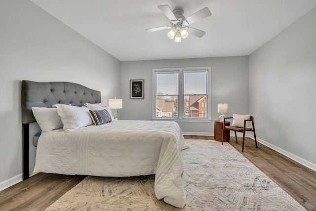 bedroom featuring ceiling fan and dark hardwood / wood-style flooring