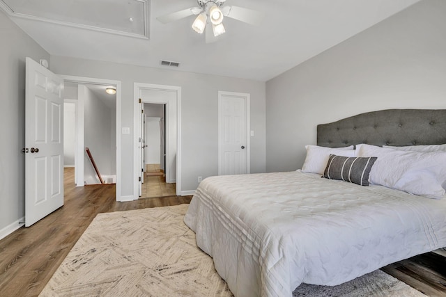 bedroom featuring wood-type flooring and ceiling fan