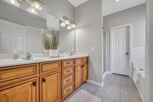 bathroom featuring vanity, separate shower and tub, and tile patterned floors