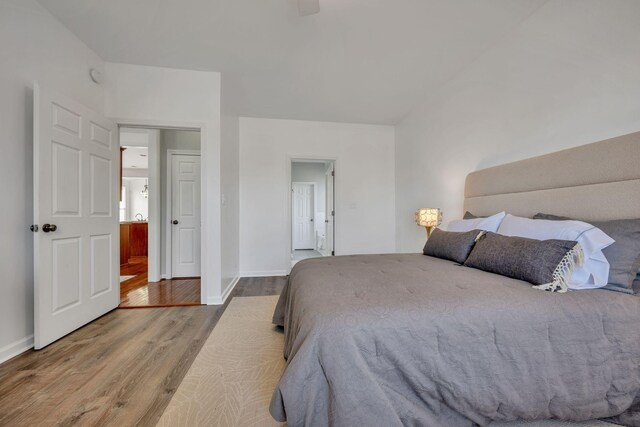 bedroom with ceiling fan and light hardwood / wood-style flooring