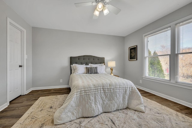 bedroom featuring dark hardwood / wood-style floors and ceiling fan