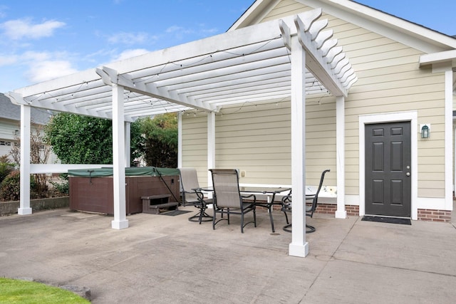 view of patio featuring a hot tub and a pergola