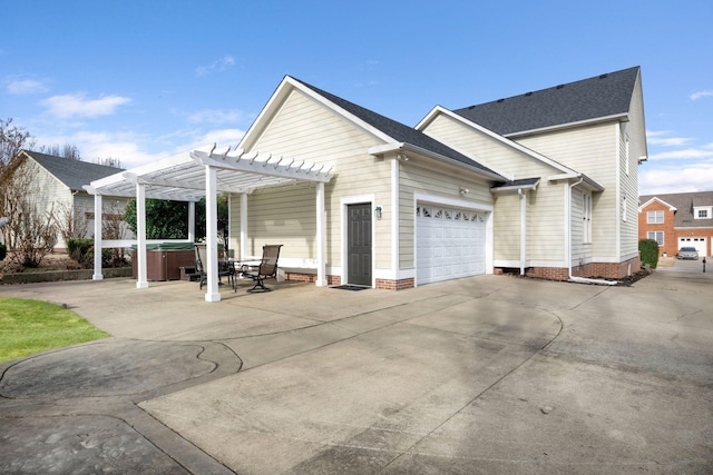 view of property exterior featuring a garage, a pergola, a patio area, and a hot tub