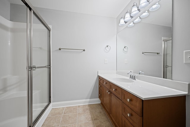 bathroom with vanity, tile patterned floors, and a shower with shower door