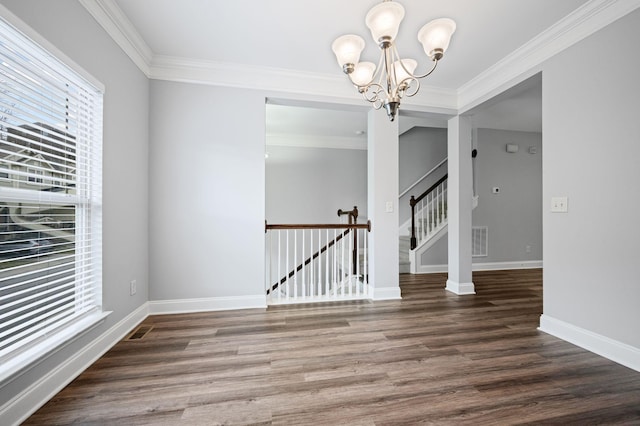 unfurnished dining area featuring a notable chandelier, dark wood-type flooring, and ornamental molding